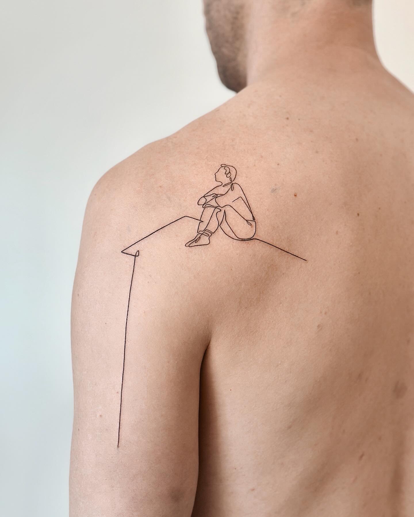 Minimal single needle line art figure tattoo